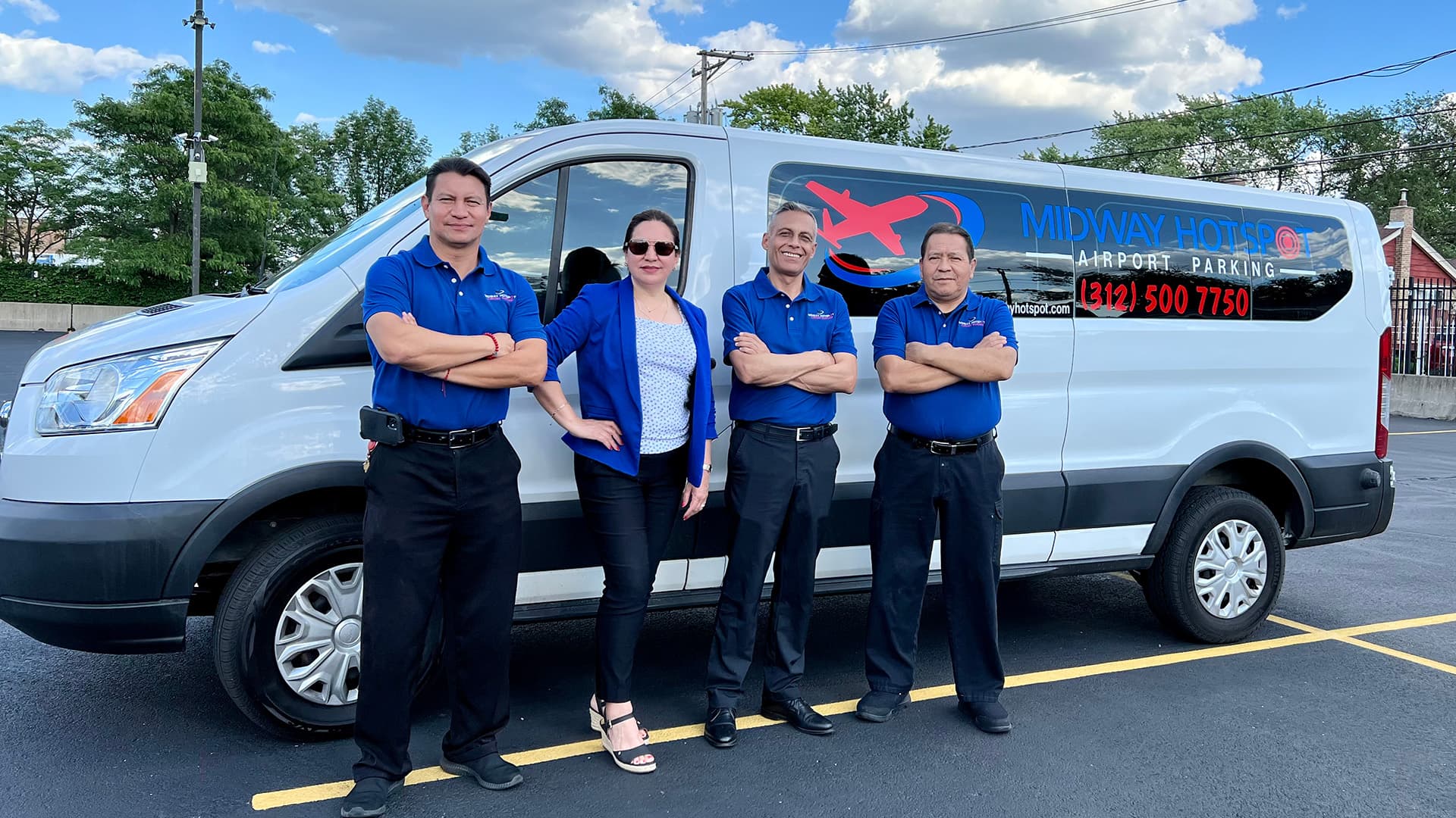 Midway HotSpot team standing beside the airport shuttle